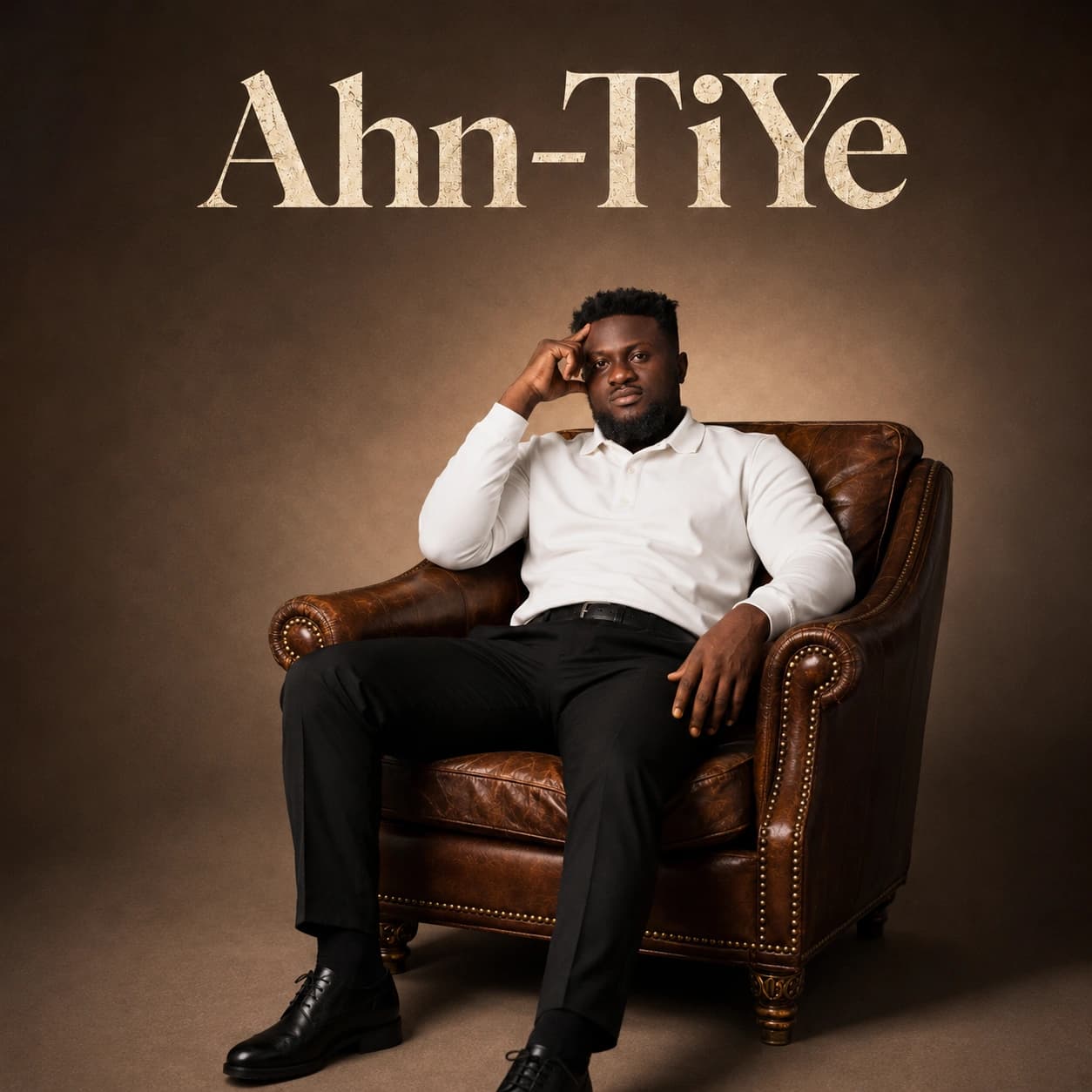 Ahn-TiYe seated in a leather chair