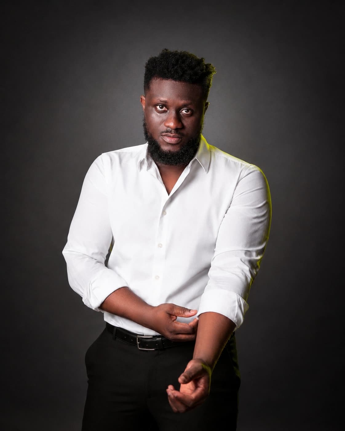Official portrait of Ahn-TiYe in a white shirt