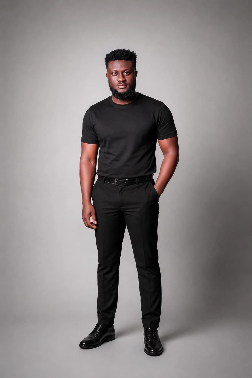 Full-length studio portrait of Ahn-TiYe dressed in black